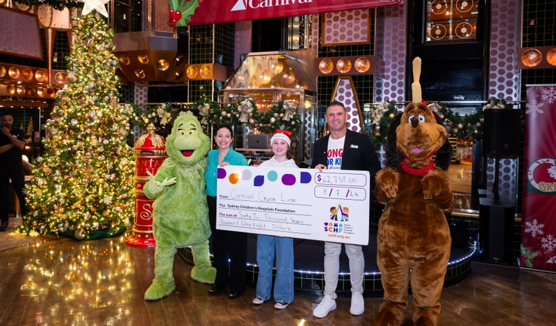 Carnival presenting a cheque to the SCHF - L-R The Grinch SCHF CMO Kate Ferguson Carnival Splendor Goddaughter Matilda Jenkins Carnival Splendor Cruise Director Simon London Max