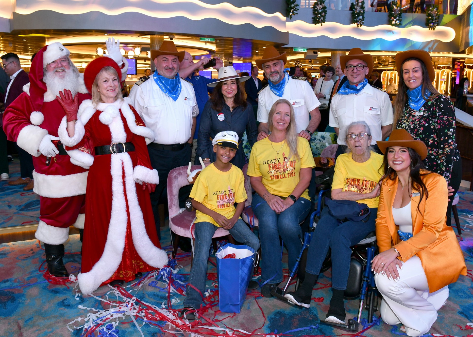 Carnival Cruise Line President Christine Duffy and leadership officers pose with first family to board Carnival Jubilee