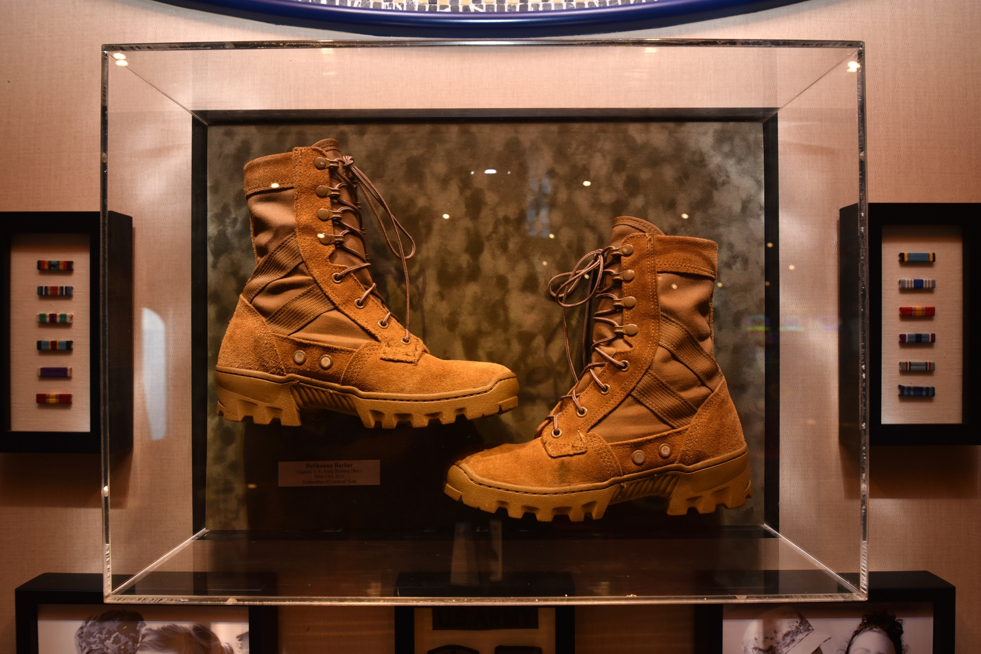 Deshauna Barbers boots on display in new Heroes Tribute Bar on board Carnival Legend