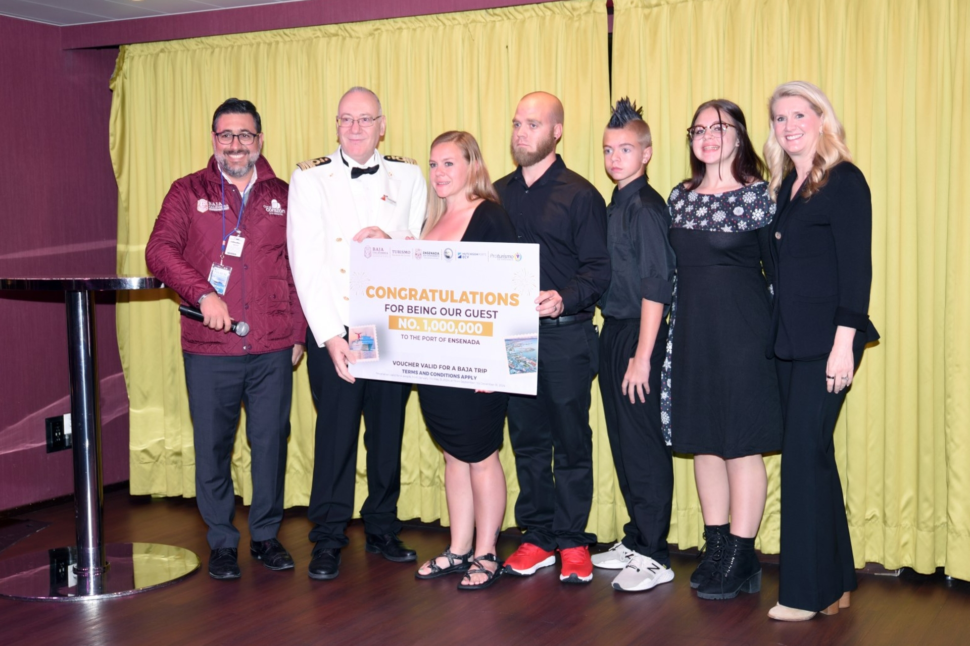 The Andrus family is celebrated by Ensenada tourism leaders Carnival Radiance officers and Carnival Corp. EVP Jan Swartz